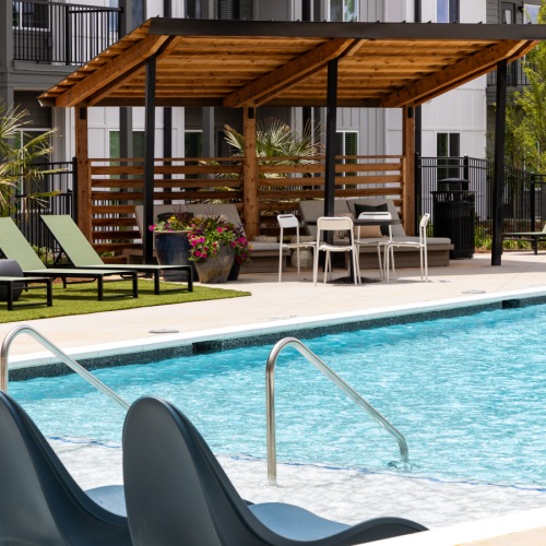 Resort-style pool with sundeck & pergolas at Ava Oakwood apartments in Gainesville, GA Resort-style pool with sundeck & pergolas at Ava Oakwood apartments in Gainesville, GA