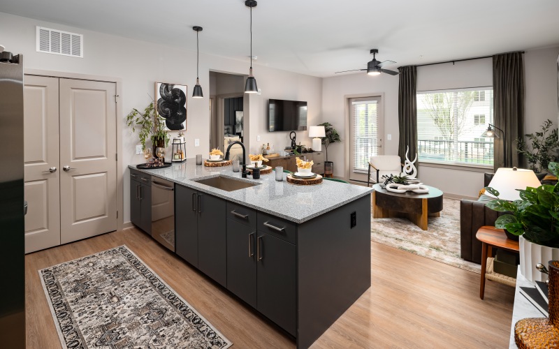 Luxury kitchen with breakfast bar at Ava Oakwood apartment complex in Gainesville	
