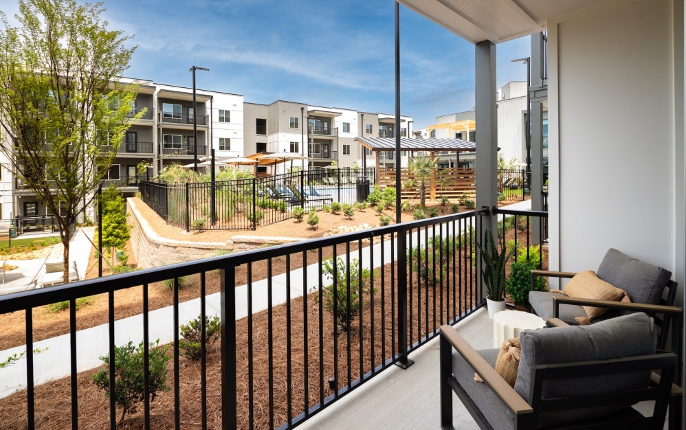 Furnished outdoor patio at Ava Oakwood apartments in Gainesville