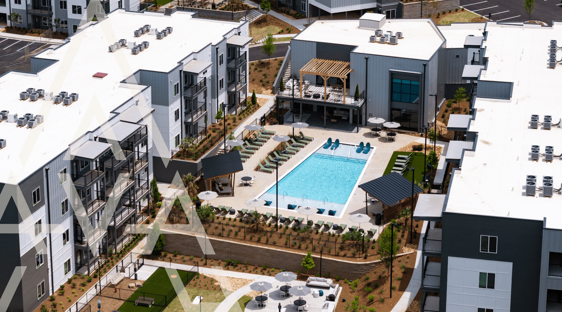 Resort-style pool with sundeck & pergolas at Ava Oakwood apartments in Gainesville, GA Resort-style pool with sundeck & pergolas at Ava Oakwood apartments in Gainesville, GA