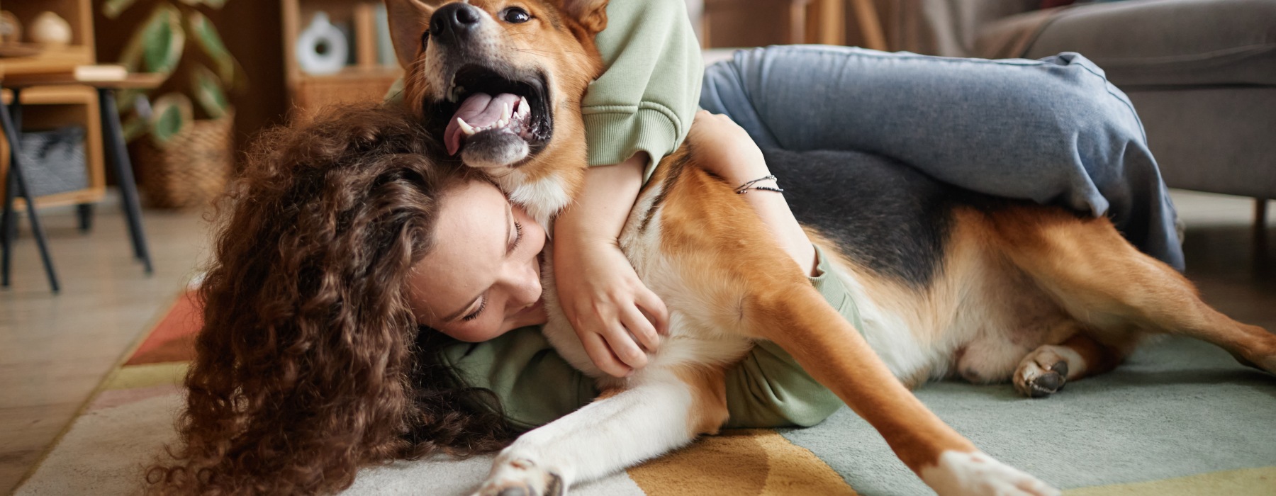 a woman playing with her pet